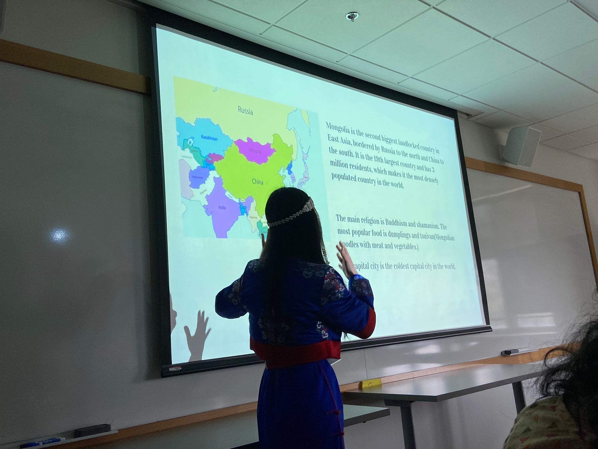 Presenting about Mongolia with traditional clothes DEEL.